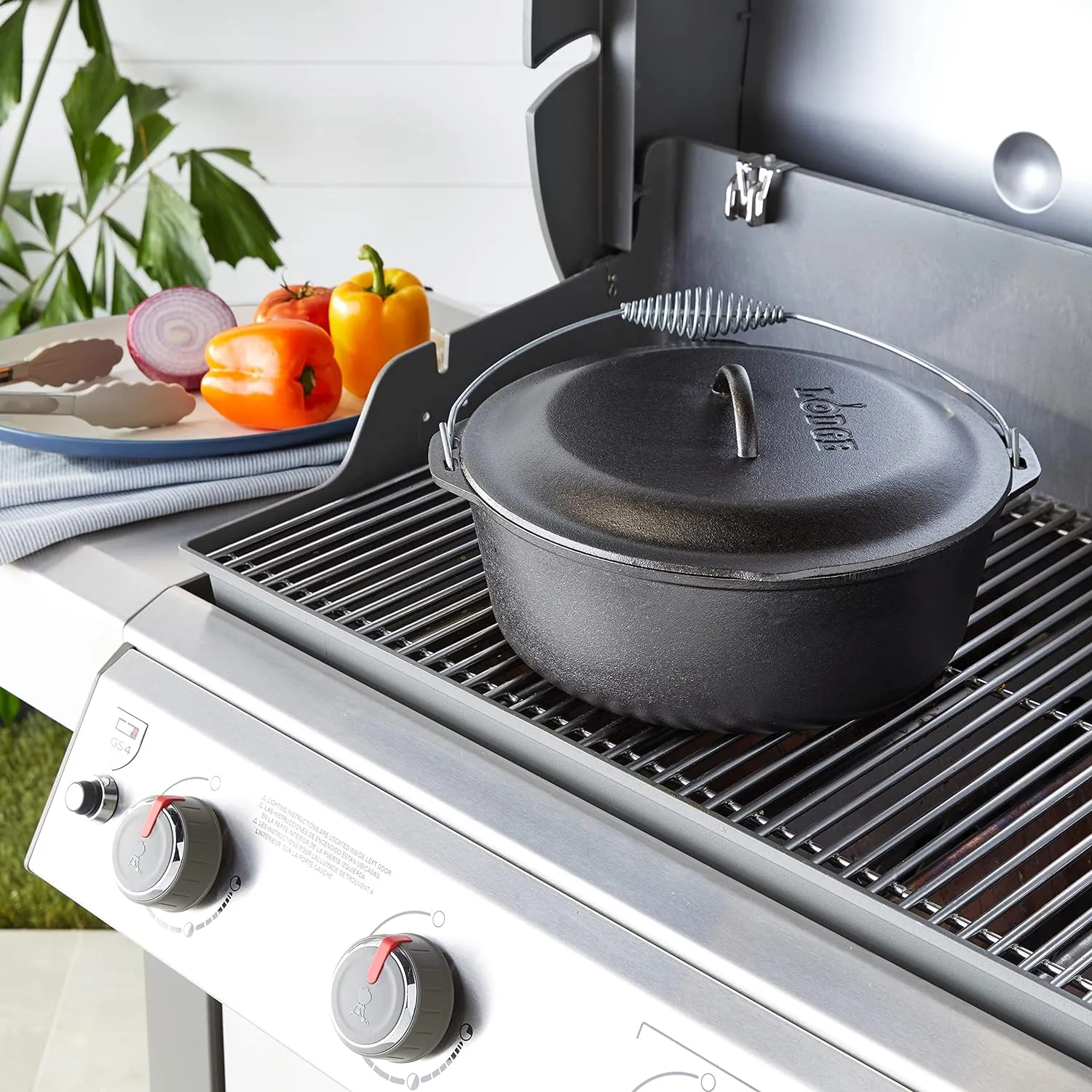 Lodge 9 Quart Pre-Seasoned Cast Iron Dutch Oven with Lid - Wire Bail Handle for Easy Transfer from Cooking Surface to Table - Use in the Oven, on the Stove, on the Grill or over the Campfire - Black